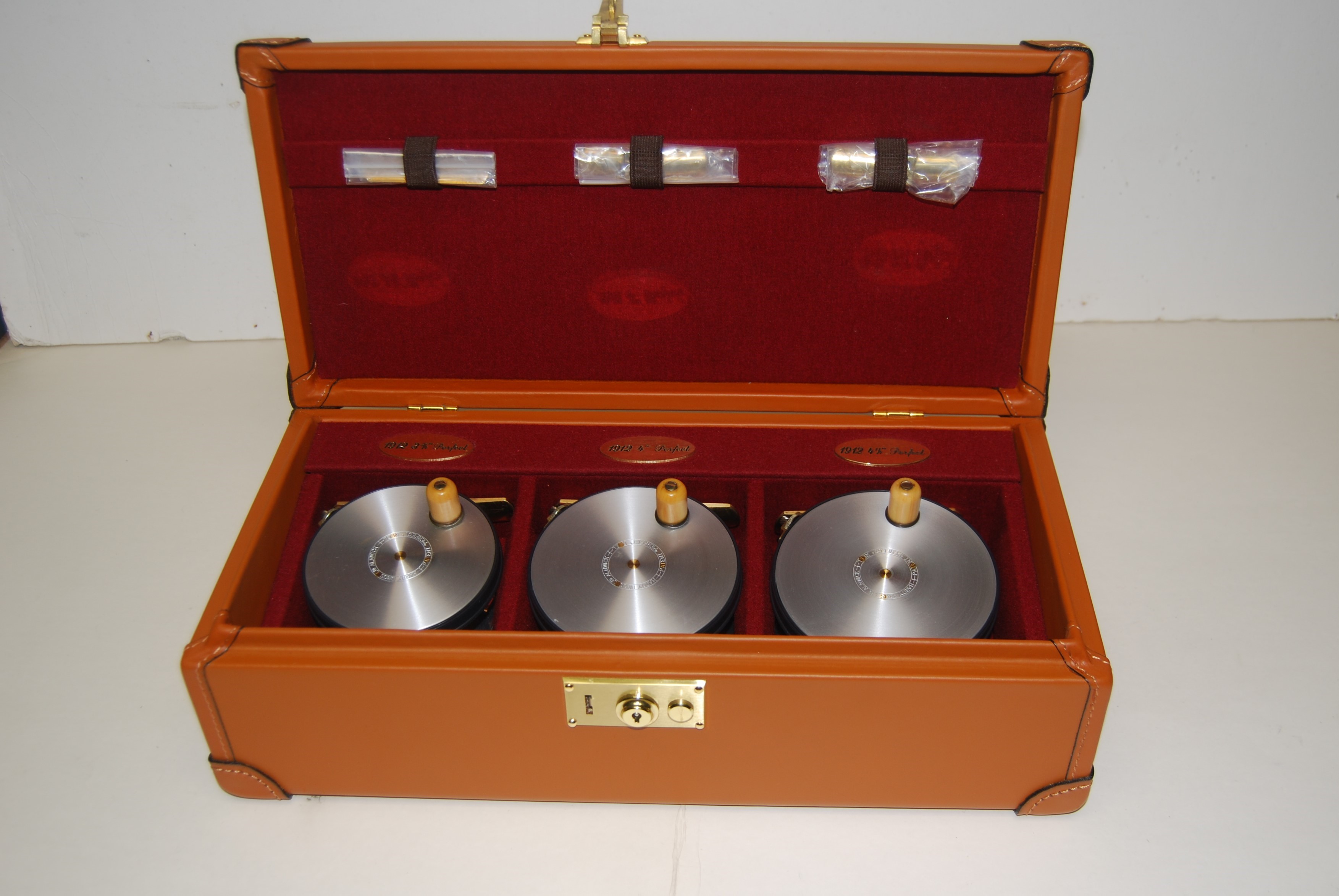 HARDY PERFECT 1912 Wide Spool Salmon Reproduction. LHW. Matched set of 3  reels in Hardy fitted Leather Case. 3 3/4 in., 4 in., 4 1/4 in. #083 of 200  Cased Sets. SOLD