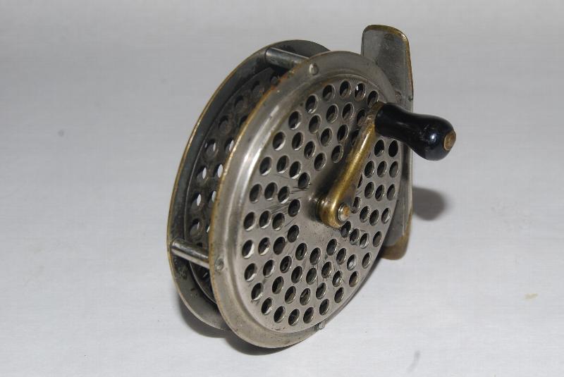 2 7/8 ORVIS PATENT 1874 Fly Reel. RHW. 4 1/2 oz. 2nd Model with riveted  construction. Tail plate cap marked: C.F.Orvis Manchester, VT – Patented  May 12th, 1874. Original screw-on handle; in original walnut box