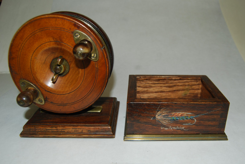 4 3/8 A.W. GAMAGE. LTD. NOTTINGHAM CENTREPIN REEL on Stand. Walnut Centrepin  reel mounted on wood base with compartment in lower base; Star Back brass  backplate; Circa 1890's. SOLD