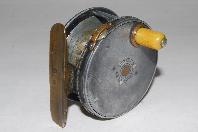 2 5/8 HARDY PERFECT Wide Spool. RH. 5 3/8 oz. Circa 1905-1912. Strapped  tension screw on rim; Smooth 2 5/8 in. brass foot fastened with 4 rivets;  1905 check; SOLD